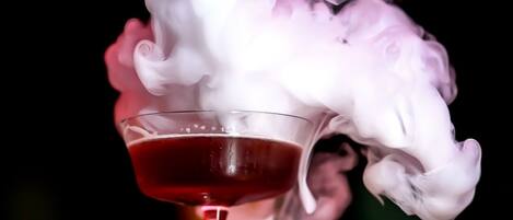 A cocktail with a smoky effect in a glass.