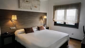 Quartos à prova de som, Wi-Fi de cortesia, roupa de cama