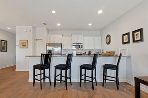 Fridge, microwave, oven, stovetop - Luxury Lakeview Villa Near Disney | South-Facing Pool + Resort Amenities (Kissimmee)