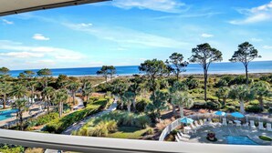 A resort with a pool, lounge chairs, and a view of the beach and ocean. - Amazing Oceanfront View with Heated Pool! Steps from the Beach (Hilton Head Island)