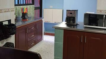 Fridge, microwave, stovetop, coffee/tea maker