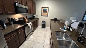 Coffee/tea maker, fridge, microwave, oven