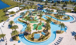 A resort with a large swimming pool, a water slide, and a golf course. - Minutes to Disney | Private Pool, Resort Amenities & BBQ Grill - 1600ST (Kissimmee)