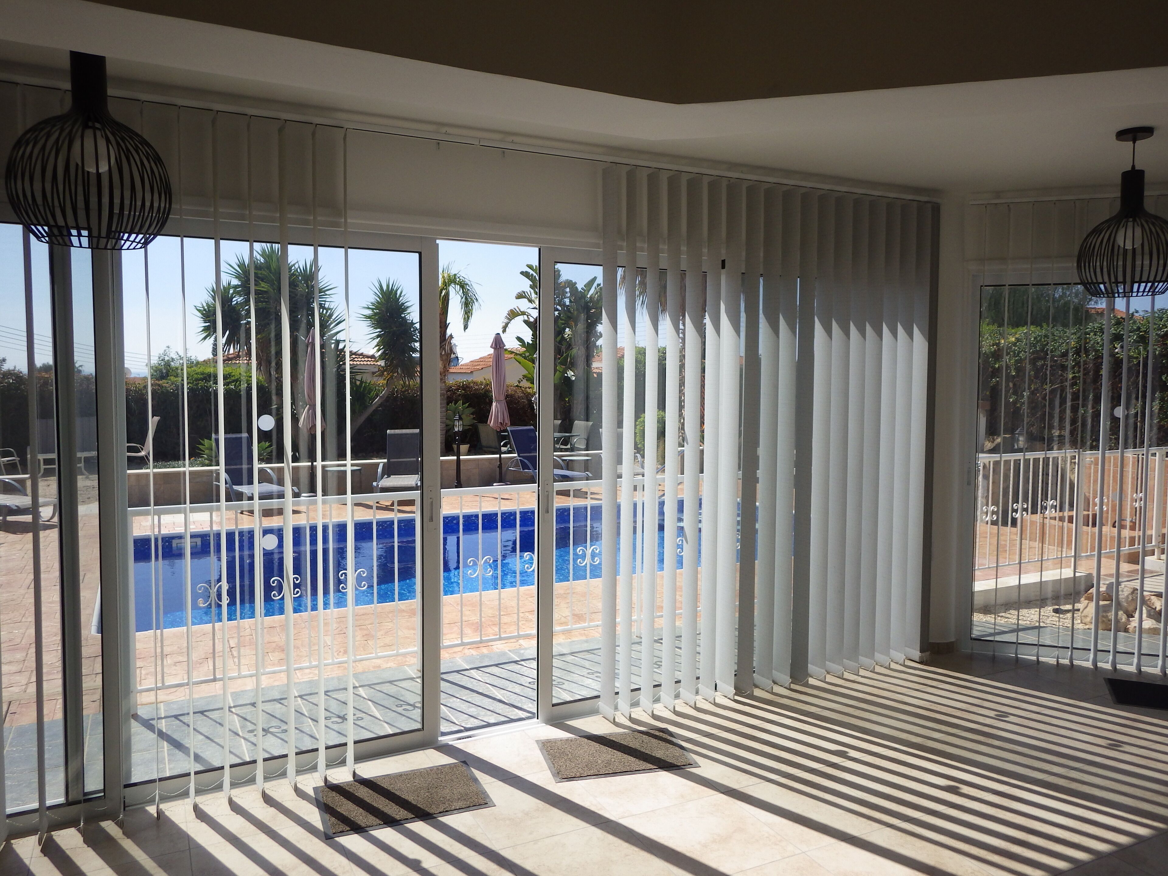 A heated pool, sun loungers