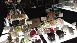 A display of various products including bottles, boxes, and decorative items, likely in a retail or gift shop setting. - Restay Hiroshima - Adult Only (Hiroshima)