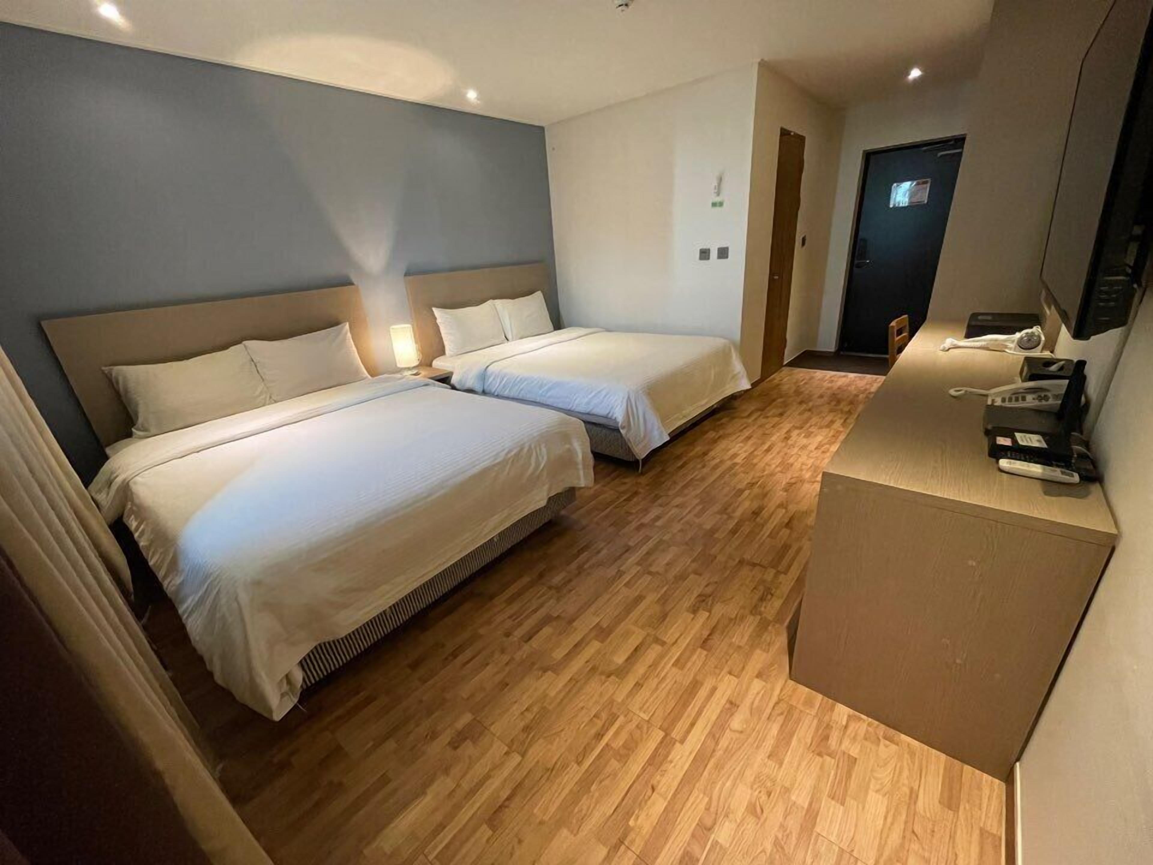 ocean view 4 persons family room | premium bedding, blackout curtains, soundproofing, free wifi