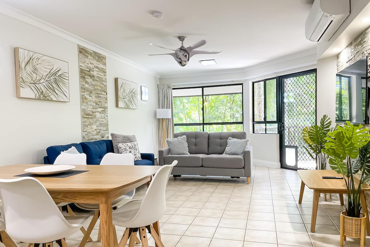 Deluxe Apartment, 3 Bedrooms, Pool View, Poolside | Living area | 43-inch flat-screen TV with satellite channels, TV, DVD player