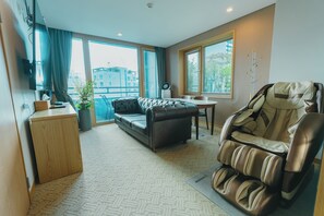 Lumia Suite | Living area | 75-inch LED TV with cable channels, TV, Netflix