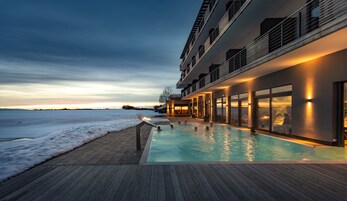 Seasonal outdoor pool, open 7:00 AM to 10:00 PM, pool umbrellas