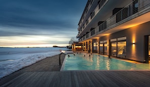 Seasonal outdoor pool, open 7:00 AM to 10:00 PM, pool umbrellas