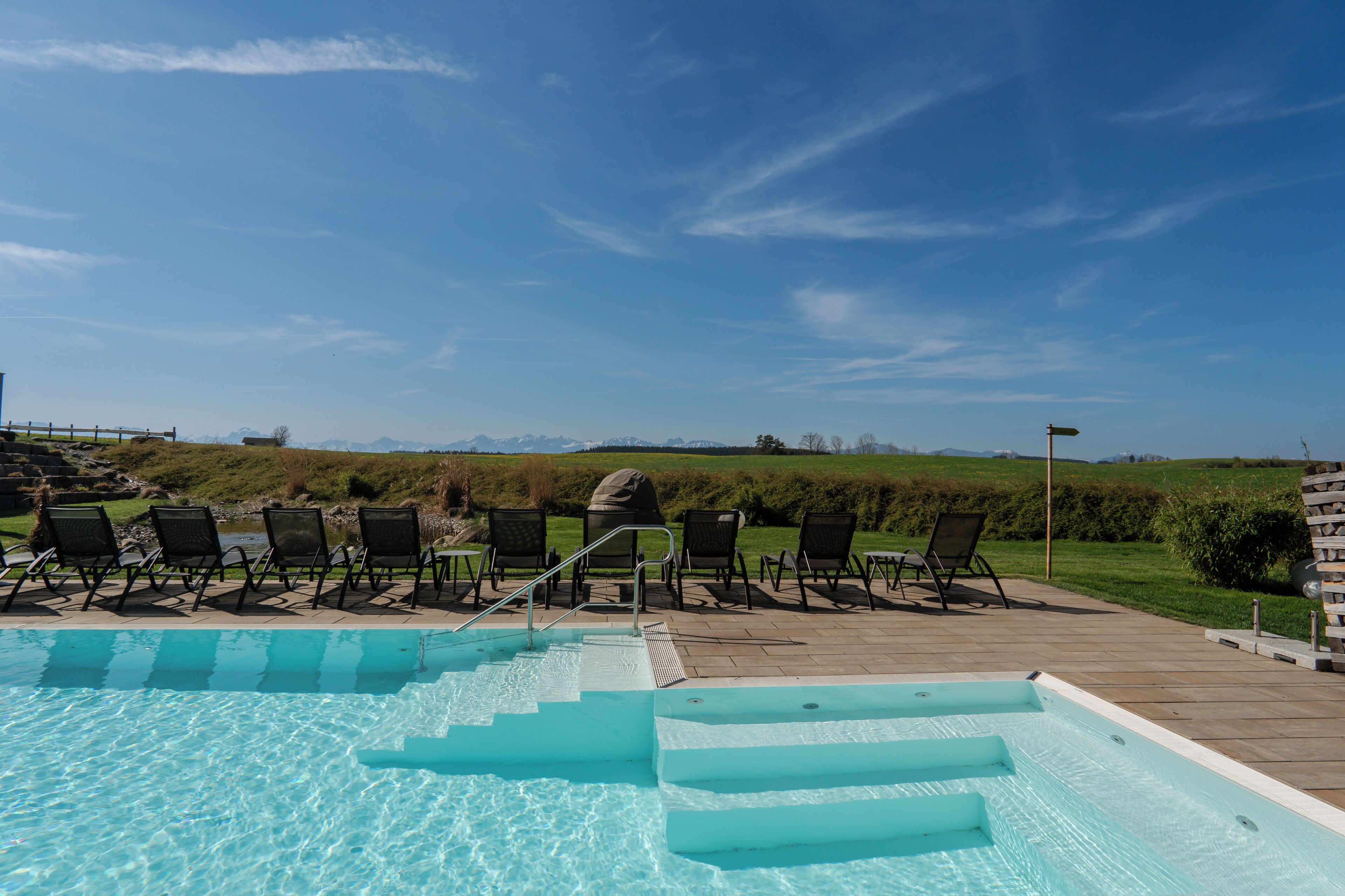 Seasonal outdoor pool, open 7:00 AM to 10:00 PM, pool umbrellas