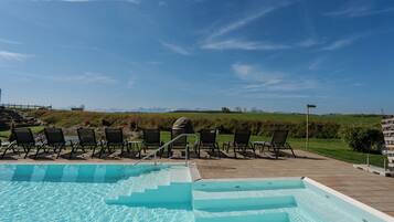 Seasonal outdoor pool, open 7:00 AM to 10:00 PM, pool umbrellas