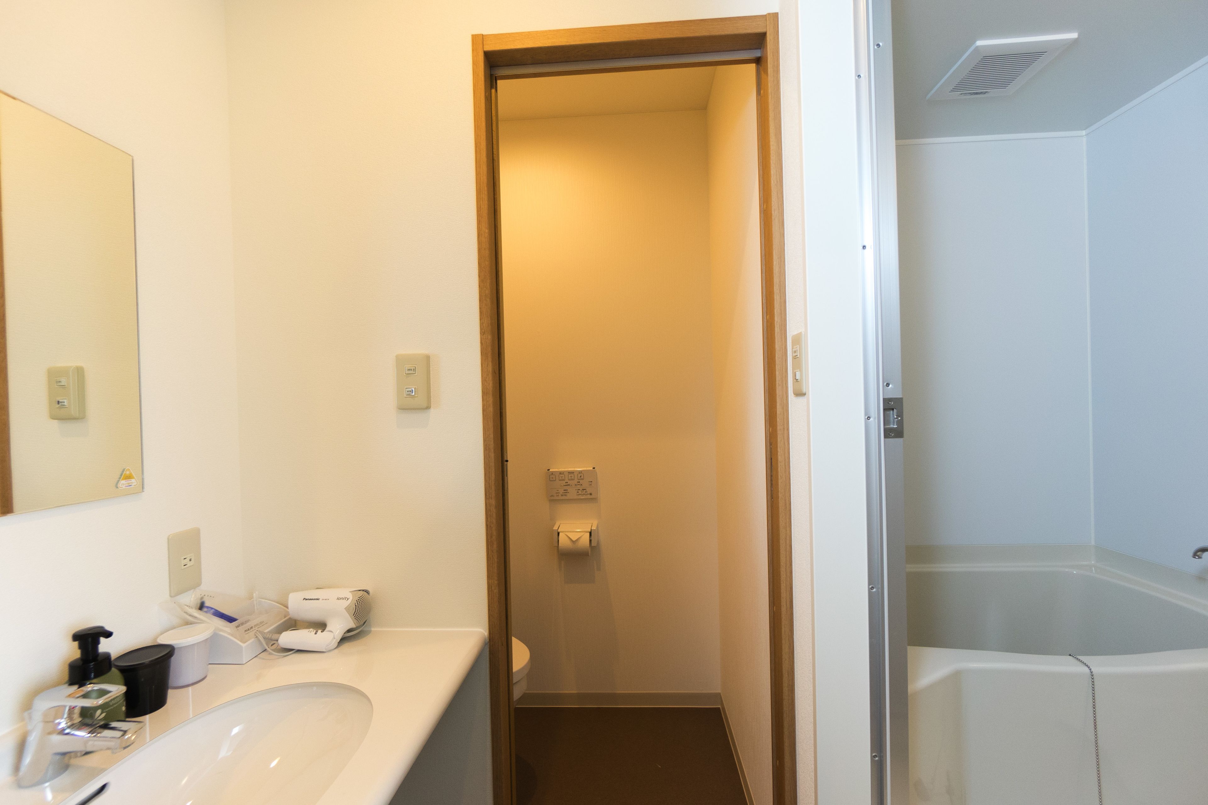 double room | bathroom | separate bathtub and shower, hair dryer, slippers, bidet