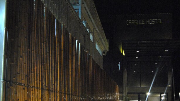A nighttime view of a building with a sign reading "Capsule Hostel." - Capsule Hostel Chiangkhan (Chiang Khan)