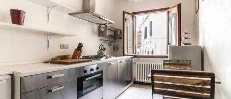 Apartment, 4 Bedrooms | Private kitchen | Full-size fridge, oven, stovetop, electric kettle