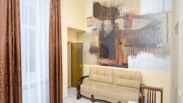 Studio, Sauna | Living area | Flat-screen TV