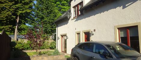 A house with a car parked in the driveway.
