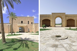 Two distinct structures stand side by side, showcasing a modern building with a symmetrical facade and an ancient stone archway.