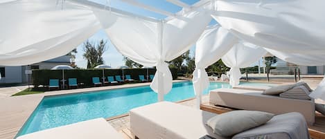 Seasonal outdoor pool, pool loungers