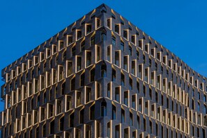 A modern building with a geometric facade and uniform window patterns. - Mak Albania Hotel (Tirana)