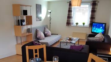 Executive Apartment | Living area | Flat-screen TV