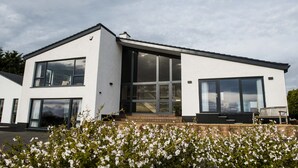 A modern two-story house with large windows and a flat roof. - Peartree Hill (Belfast)