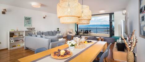 Deluxe Apartment, 2 Bedrooms, Ocean View, Beachfront | Living room | Flat-screen TV