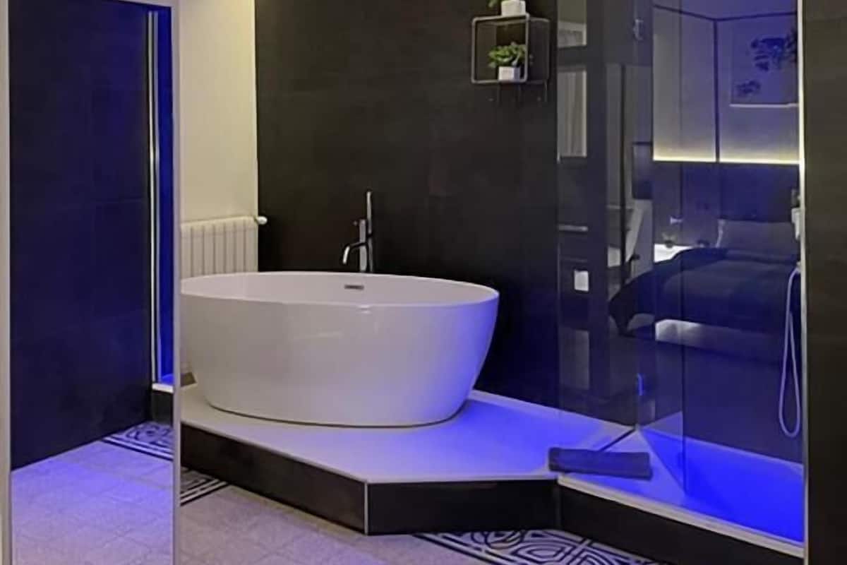 Junior Suite, Balcony, Sea View | Minibar, in-room safe, desk, iron/ironing board