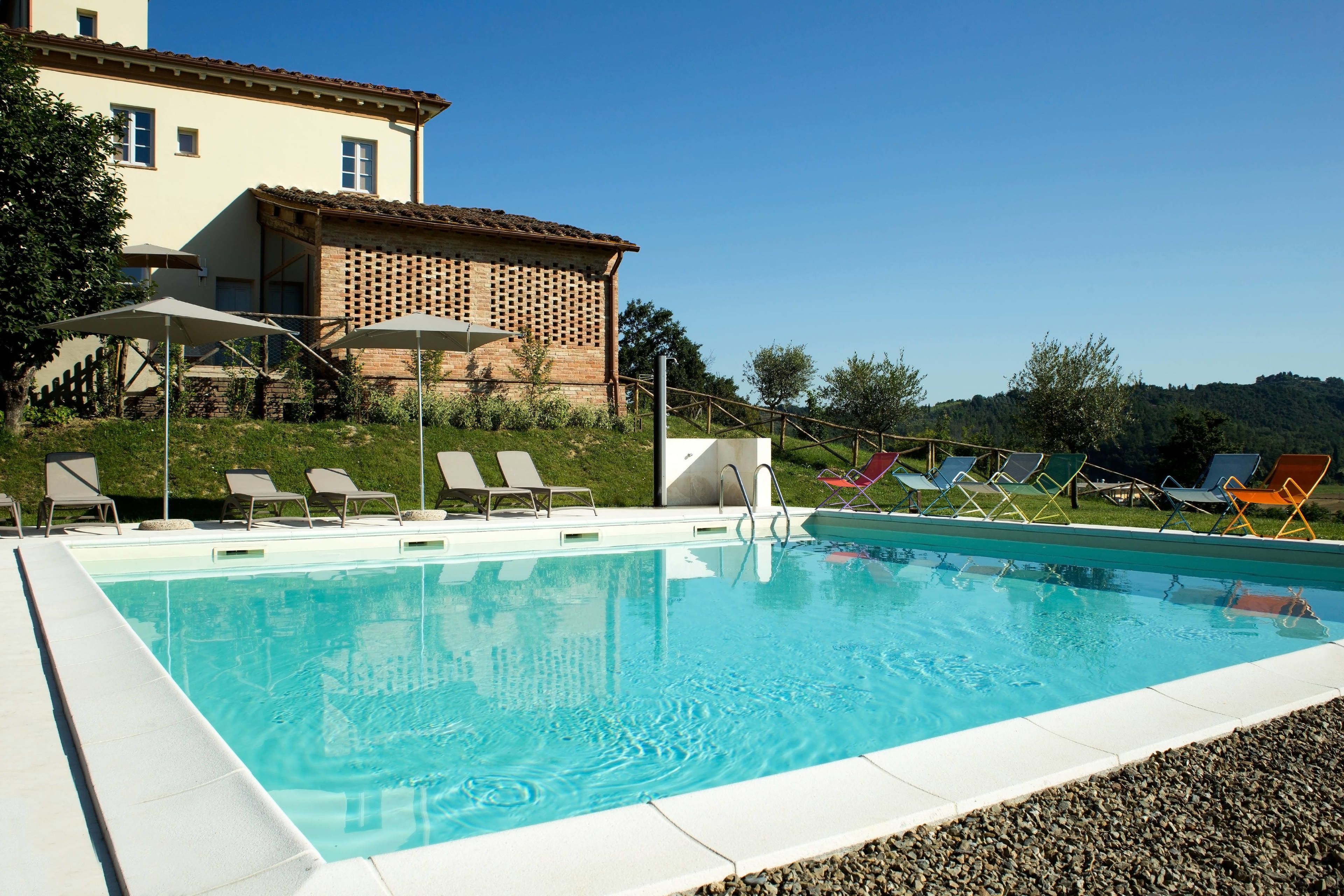 seasonal outdoor pool, open 10:00 am to 7:00 pm, pool umbrellas