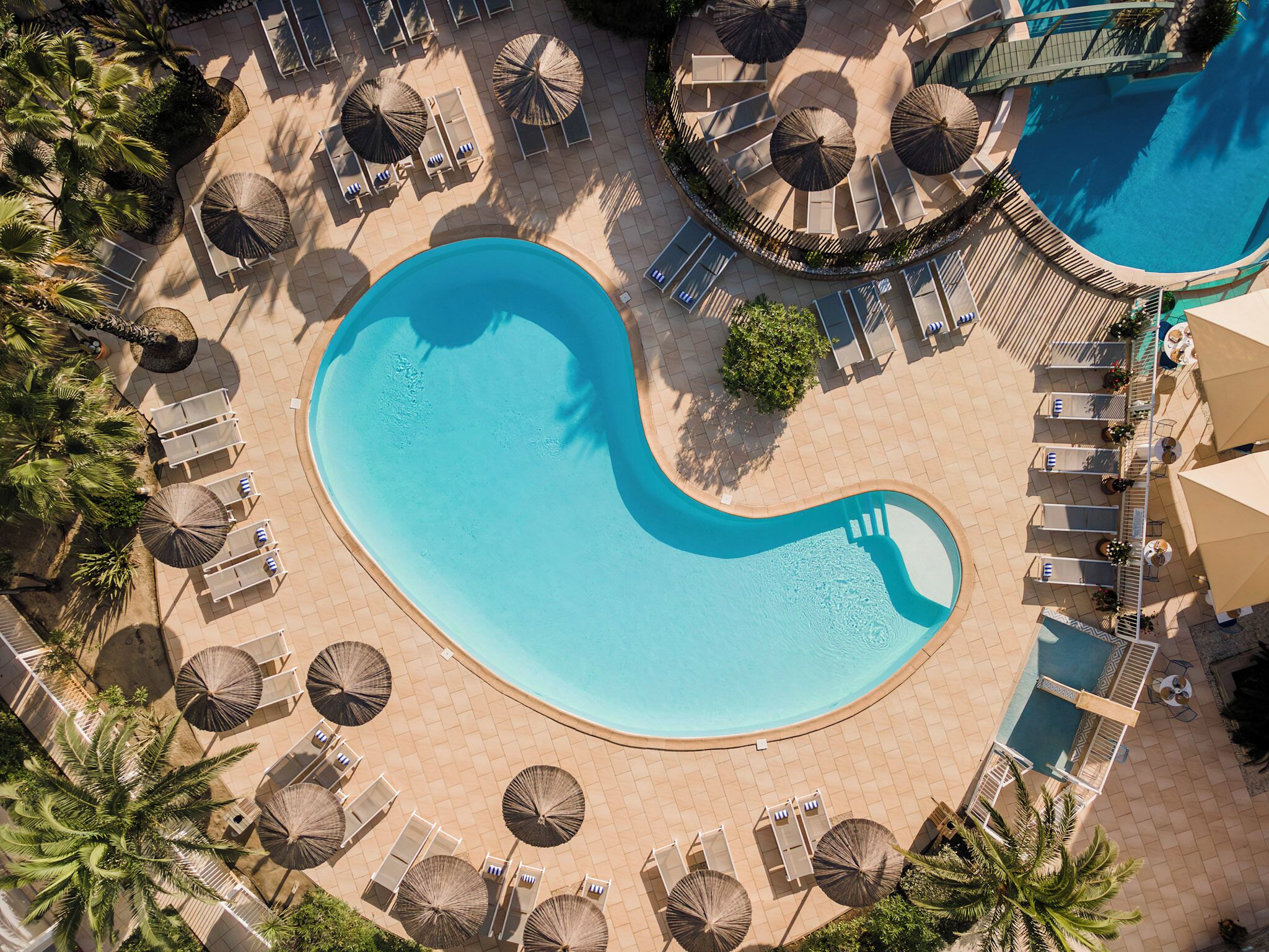 Outdoor pool, open 9 AM to 7:30 PM, pool umbrellas, pool loungers