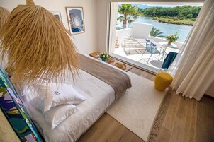 Signature Room, 1 King Bed, Terrace, Lagoon View (Chambre Bulle Signature) | In-room safe, desk, soundproofing, free cribs/infant beds