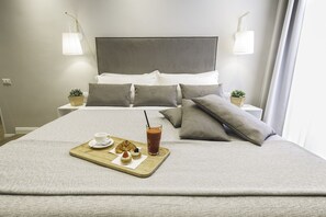 ห้องดีลักซ์ | ผ้าปูที่นอน Frette จากอิตาลี, เครื่องนอนระดับพรีเมียม, ผ้านวมขนเป็ด