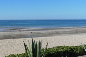 On the beach, sun-loungers, beach towels