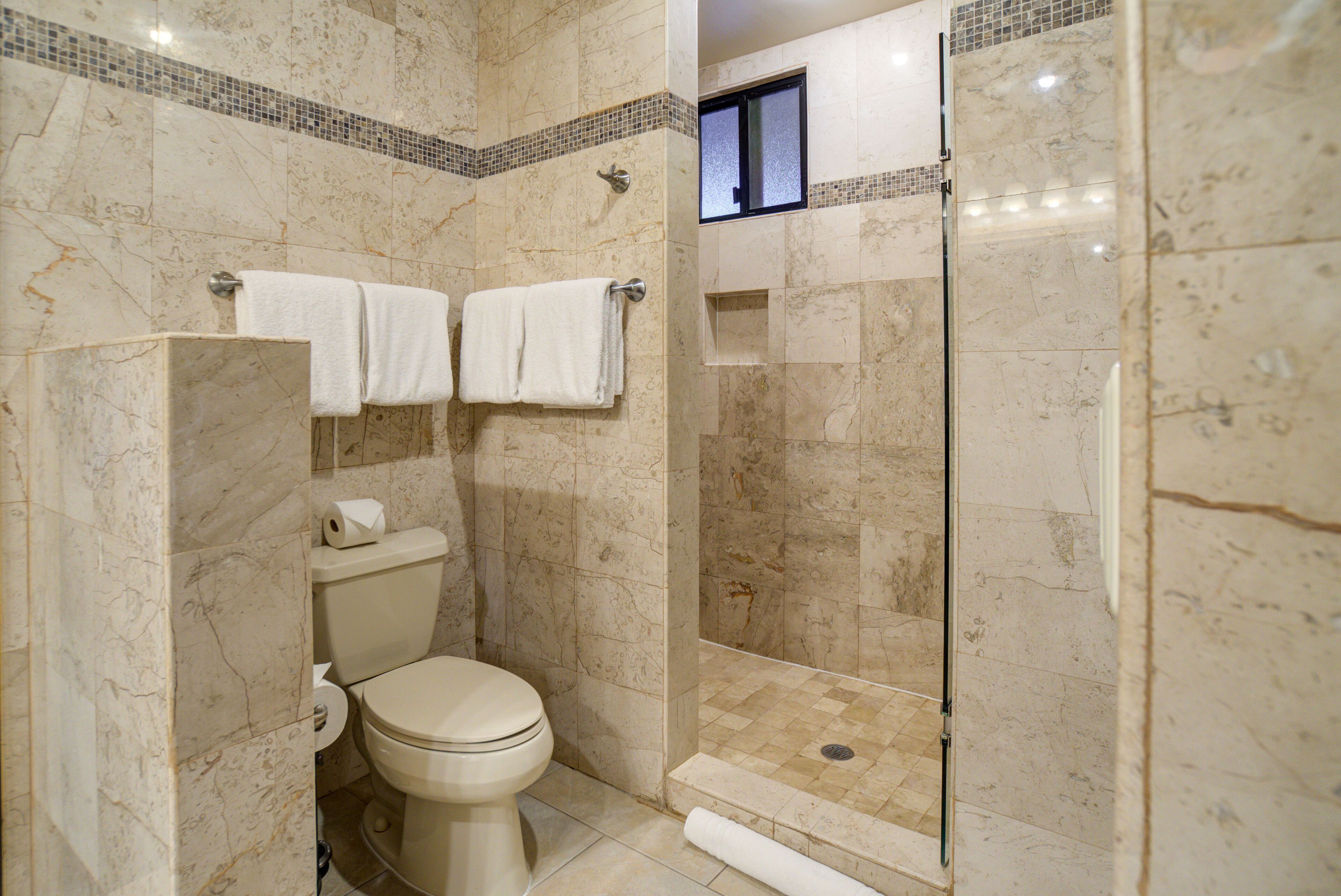 Shower, hair dryer, towels, soap