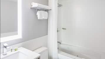 Combined shower/bathtub, designer toiletries, hair dryer, towels