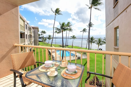 Outdoor dining. Oceanfront condo with pool & balcony - walk to dining, activities, and more