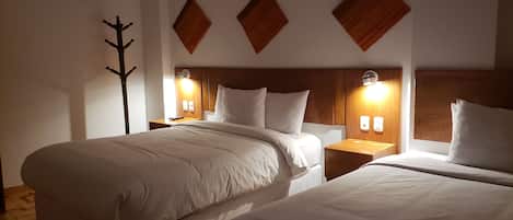 Twin Room | Down comforters, in-room safe, individually furnished, desk
