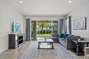 Encore 8 Bedroom Home with Pool (2311) | Living room | 42-inch Smart TV with digital channels, Netflix, streaming services - Encore Resort (Kissimmee)