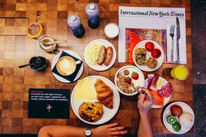 Daily buffet breakfast (USD 22 per person)