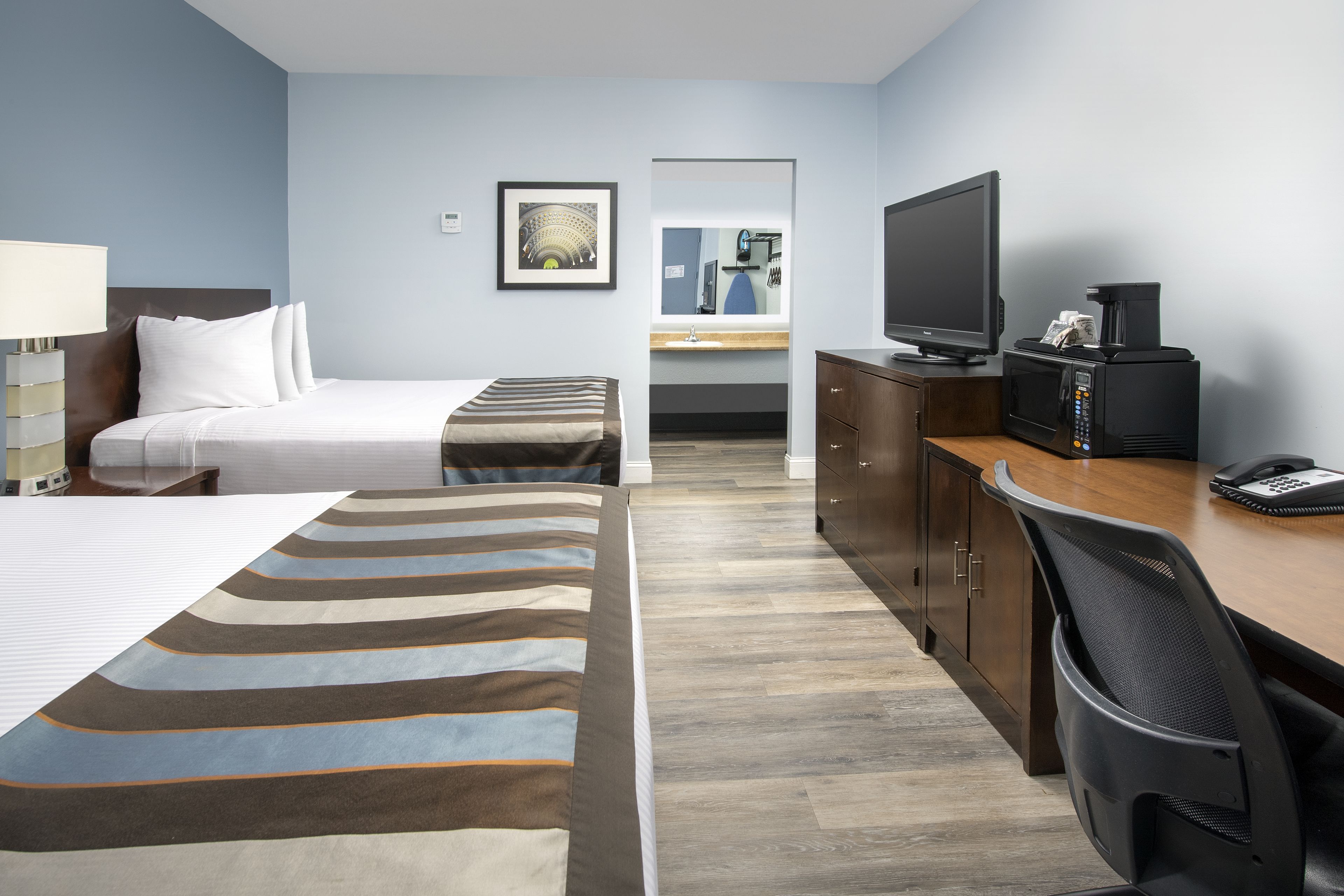 Deluxe Room, 2 Queen Beds | Desk, laptop workspace, blackout drapes, iron/ironing board