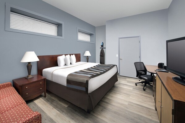 Habitación Deluxe, 1 cama King size | Escritorio, espacio para trabajar con laptop y cortinas blackout 