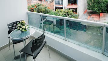 Family Double Room, 2 Queen Beds | Living area | 32-inch TV with cable channels, heated floors