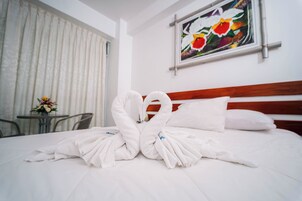 Premium Room, 1 King Bed, Balcony | Premium bedding, down comforters, memory foam beds, desk