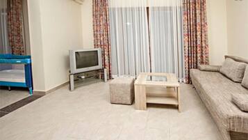 Apartment, 2 Bedrooms, Sea View | Living area | Flat-screen TV