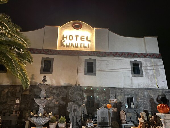 A building with a sign reading "HOTEL KHAUTLI" at the top.