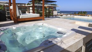 A hot tub with a wooden canopy and a view of the ocean. - 2 BR Ocean View PH- Jacuzzi and Private Pool steps from Mamitas Beach (Playa del Carmen)