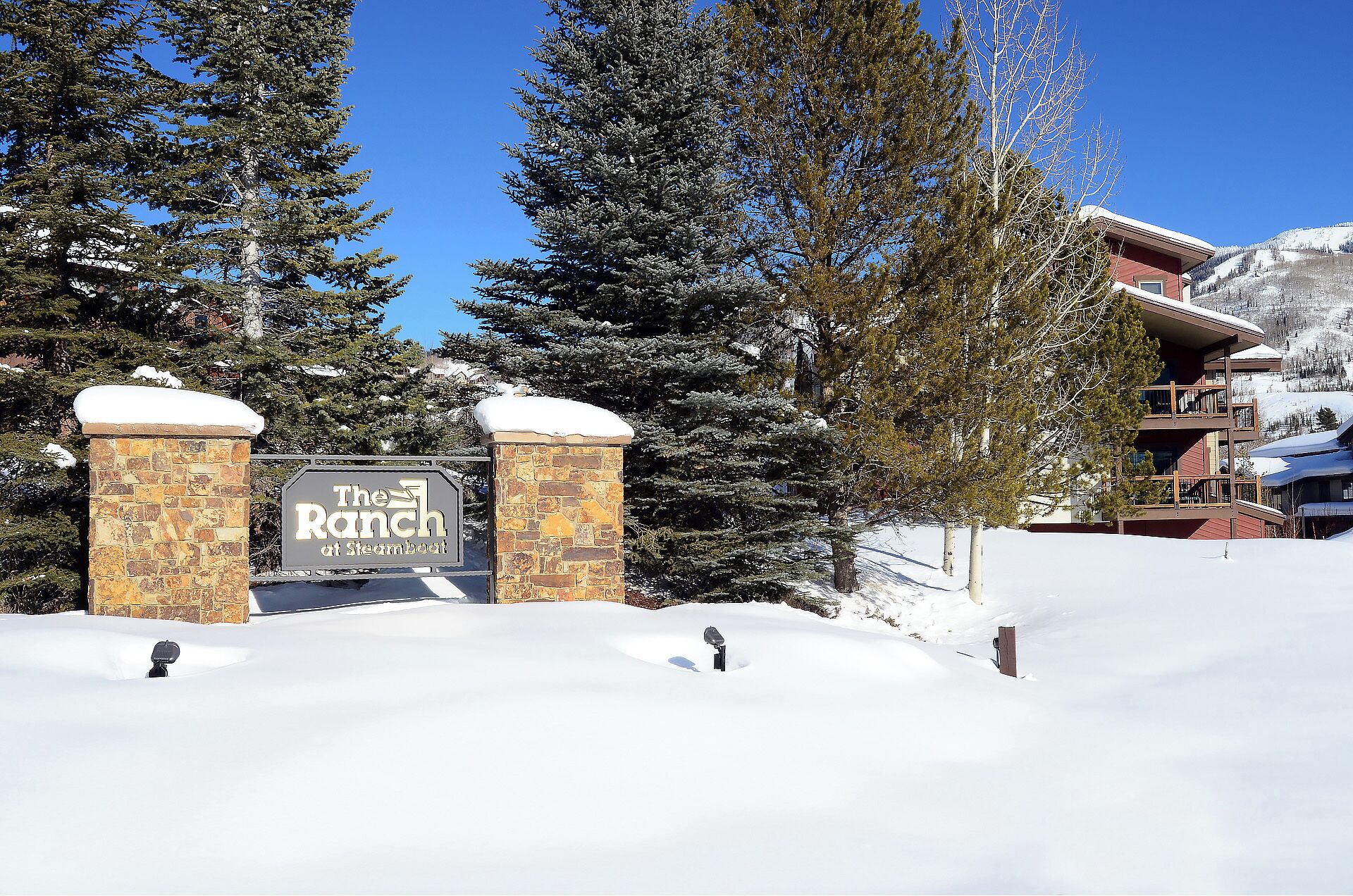 A snow-covered entrance with a sign reading "The Ranch at Steamboat."