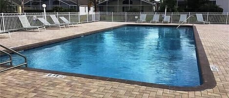 A heated pool, pool loungers