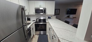 Fridge, oven, stovetop, coffee/tea maker