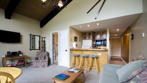 A spacious living area with a kitchen, a dining area, and a seating space. - W3537 | Exceptional View | Walk to Mtn Village | Pool | Hot Tub | Winter Shuttle (Steamboat Springs)